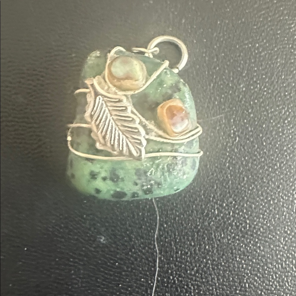 Turquoise stone wire wrapped in silver